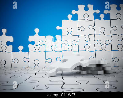 Puzzle wall with missing pieces on blue background Stock Photo