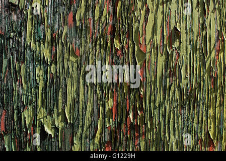 Peeling flaking green paint on a dilapidated railway wagon Stock Photo