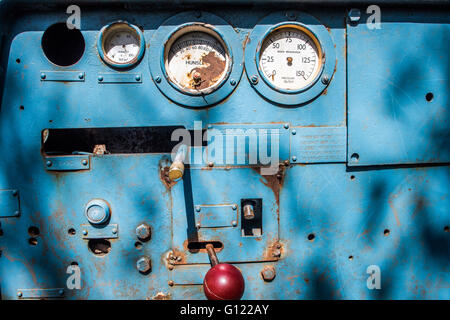 Pressure gages and operating control panel on an old mine train - clearwell caves Stock Photo