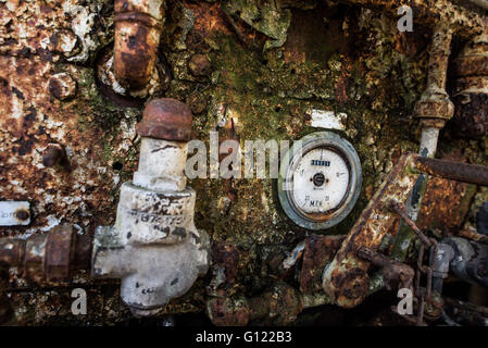 rusty peeling paint on an  old Pressure gages and operating control panel on an old mine train - clearwell caves Stock Photo
