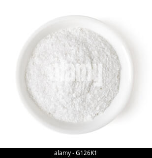 Bowl of white table salt isolated on white background, top view Stock Photo