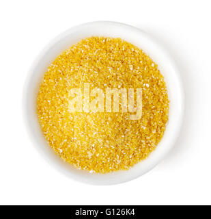 Bowl of yellow corn grits isolated on white background, top view Stock Photo