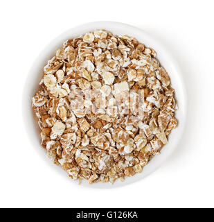 Bowl of oat flakes isolated on white background, top view Stock Photo