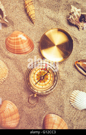 sea shells and compass Stock Photo - Alamy