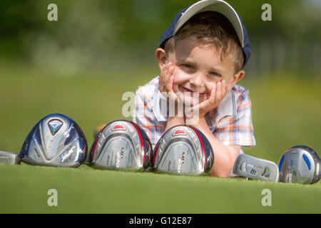 young boy playing golf Stock Photo