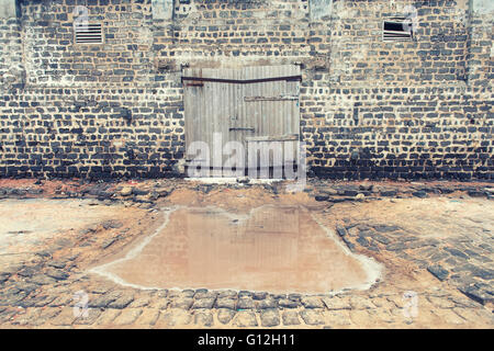 wall of ancient wooden barn with door Stock Photo