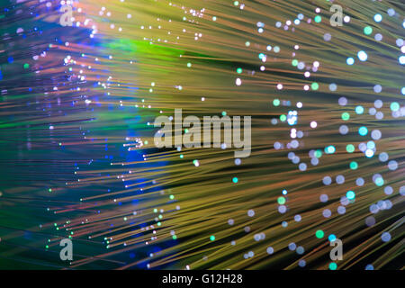optical fibres dinamic flying from deep on technology background Stock Photo