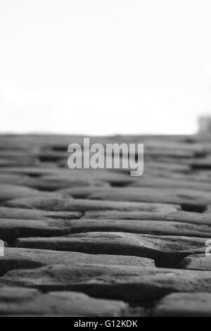 Cobbles on a street close up in black and white Stock Photo