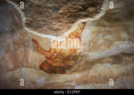 Ancient frescoes of maidens on cave wall at Sigiriya Rock Fortress, Sigiriya, Sri Lanka Stock Photo