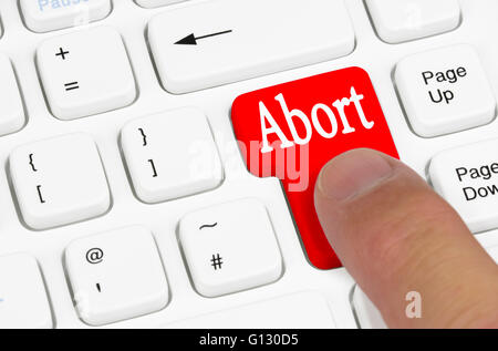 Abort key being pressed on a computer keyboard. Stock Photo
