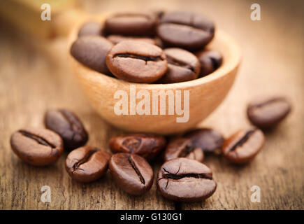 Roasted coffee bean in wooden surface Stock Photo