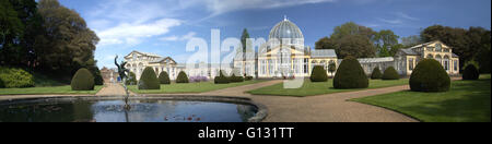 Panoramic Royal Conservatory at Syon house Isleworth on a very sunny Sunday. With a water fountain  with a statue of Mercury. Stock Photo