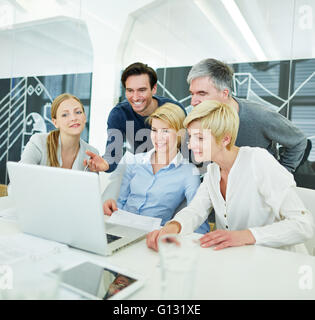 Happy business people getting computer training in the office Stock Photo