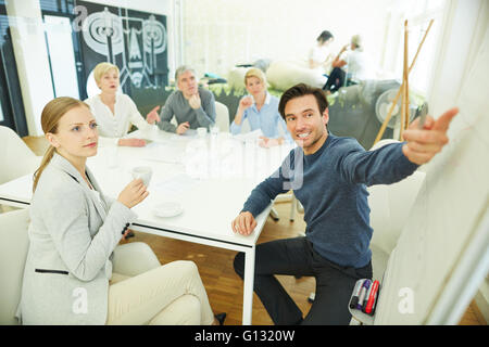 Business man giving presentation in meeting in the office Stock Photo