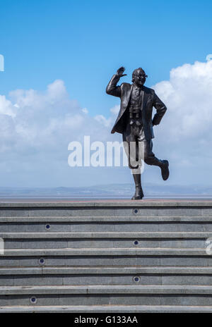 Bronze statue of comedian, Eric Morecambe, on the promenade in Morecambe, Lancashire UK Stock Photo