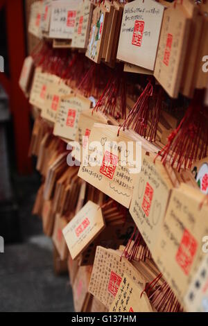 Ema, Japanese Prayer Tablets. Small wooden plaques onto which worshippers write wishes or prayers in Temple, Kyoto, Japan Stock Photo