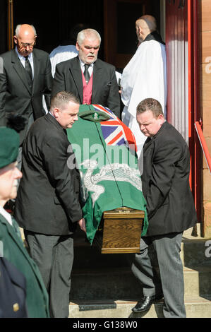 The coffin of an ex-soldier is carried from a church. Stock Photo