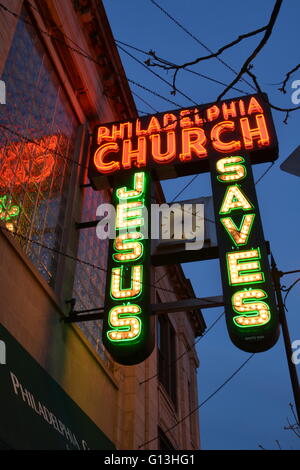 The 1940 neon sign to the Philadelphia Church on Chicago's north side Andersonville neighborhood in a former bank building. Stock Photo