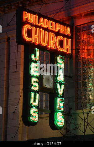 The 1940 neon sign to the Philadelphia Church on Chicago's north side Andersonville neighborhood in a former bank building. Stock Photo