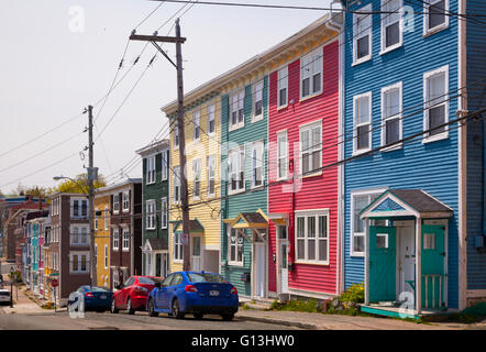 Pastel coloured row houses (Jellybean Row) in downtown St. John's, Avalon Peninsula, Newfoundland, Canada. Stock Photo