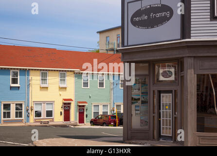 Pastel coloured row houses (Jellybean Row) in downtown St. John's, Avalon Peninsula, Newfoundland, Canada. Stock Photo