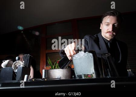 a man serves cocktails in a bar Stock Photo