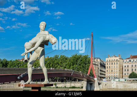 The Weight of Oneself statue on the Saone Banks near the Palais de Justice footbridge, Lyon, Rhone, France Stock Photo