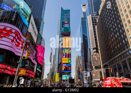 NEW YORK, USA - MAY 7, 2016: Unidentified people on the Times Square, New York. Times Square is the most popular tourist locatio Stock Photo