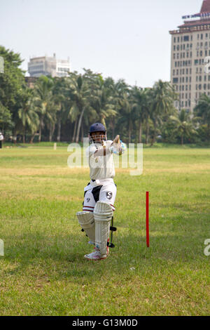 People playing cricket in the central park at Mumbai, India. Cricket is the most popular sport Stock Photo