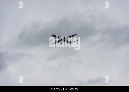 An airplane landing on a cloudy day in Lesbos Island, Greece Stock Photo