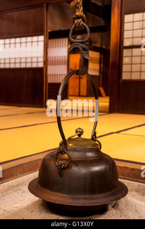 Traditional japanese home interior with tea pot over fireplace Stock Photo