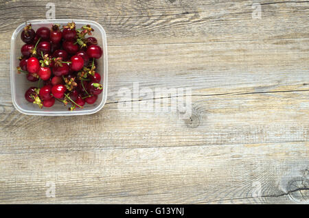 Berries on a wooden table in natural light Stock Photo