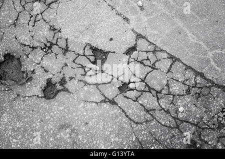Old cracked grungy asphalt road background texture Stock Photo