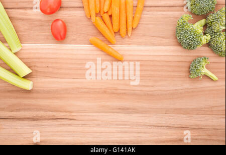 Top down view of assorted vegetables on cutting board.