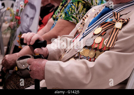 Jerusalem, Israel. 8th May, 2016.  A Russian-Israeli World War II veteran wearing war medals taking part in a ceremony commemorating 71 years since the Allies’ victory over Nazi Germany in World War II, in the center of Jerusalem Credit:  Eddie Gerald/Alamy Live News Stock Photo