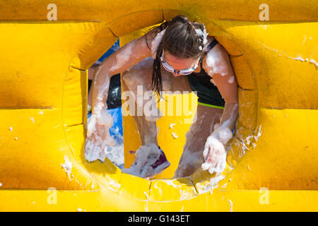 Poole, Dorset, UK. 8th May, 2016.  Foam Fest Dorset takes place at Baiter Park, Poole.  Runners dodge, dive, climb and laugh their way through a hilarious foam filled obstacle course for a 3k fun run organised by Naomi House and Jacksplace children’s hospices.  Credit:  Carolyn Jenkins/Alamy Live News Stock Photo