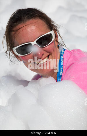 Poole, Dorset, UK. 8th May, 2016.  Foam Fest Dorset takes place at Baiter Park, Poole.  Runners dodge, dive, climb and laugh their way through a hilarious foam filled obstacle course for a 3k fun run organised by Naomi House and Jacksplace children’s hospices.  Credit:  Carolyn Jenkins/Alamy Live News Stock Photo