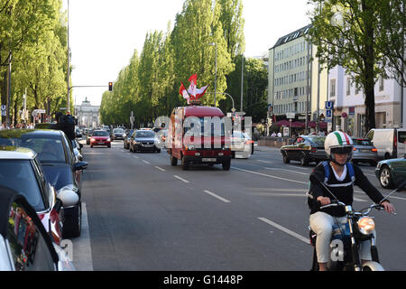 Munich, Germany. 07th May, 2016. A fan bus seen on Leopold Street after FC Bayern Munich wins the German soccer championships, in Munich, Germany, 07 May 2016. Only a handful of fans were celebrating on Munich's fan mile. With its victory against Ingolstadt, FC Bayern Munich won its fourth championship in a row and its 26th overall. Photo: FELIX HOERHAGER/dpa/Alamy Live News Stock Photo