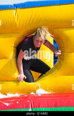 Poole, Dorset, UK. 8th May, 2016.  Foam Fest Dorset takes place at Baiter Park, Poole.  Runners dodge, dive, climb and laugh their way through a hilarious foam filled obstacle course for a 3k fun run organised by Naomi House and Jacksplace children’s hospices.  Credit:  Carolyn Jenkins/Alamy Live News Stock Photo