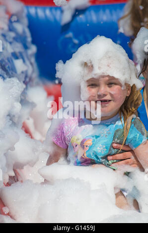 Poole, Dorset, UK. 8th May, 2016.  Foam Fest Dorset takes place at Baiter Park, Poole.  Runners dodge, dive, climb and laugh their way through a hilarious foam filled obstacle course for a 3k fun run organised by Naomi House and Jacksplace children’s hospices.  Credit:  Carolyn Jenkins/Alamy Live News Stock Photo