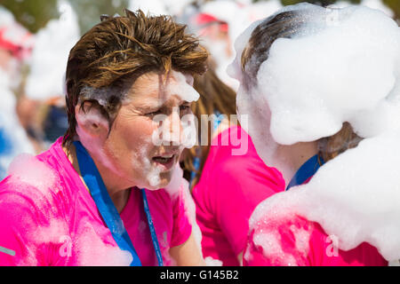 Poole, Dorset, UK. 8th May, 2016.  Foam Fest Dorset takes place at Baiter Park, Poole.  Runners dodge, dive, climb and laugh their way through a hilarious foam filled obstacle course for a 3k fun run organised by Naomi House and Jacksplace children’s hospices.  Credit:  Carolyn Jenkins/Alamy Live News Stock Photo