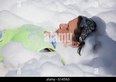 Poole, Dorset, UK. 8th May, 2016.  Foam Fest Dorset takes place at Baiter Park, Poole.  Runners dodge, dive, climb and laugh their way through a hilarious foam filled obstacle course for a 3k fun run organised by Naomi House and Jacksplace children’s hospices. Credit:  Carolyn Jenkins/Alamy Live News Stock Photo