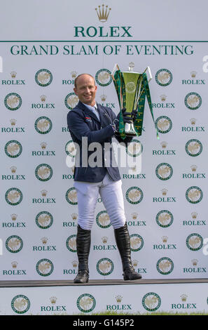 Badminton House, Badminton, UK. 08th May, 2016. Mitsubishi Motors Badminton Horse Trials. Day Five. Michael Jung (GER) displays his Trophy after winning the Rolex Grand Slam of Eventing - winning Badminton, Burghley and Kentucky. Credit:  Action Plus Sports/Alamy Live News Stock Photo