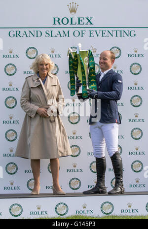 Badminton House, Badminton, UK. 08th May, 2016. Mitsubishi Motors Badminton Horse Trials. Day Five. Michael Jung (GER) is presented The Rolex Grand Slam Trophy of Eventing by HRH Duchess of Cornwall after winning Badminton, Burghley and Kentucky. Credit:  Action Plus Sports/Alamy Live News Stock Photo