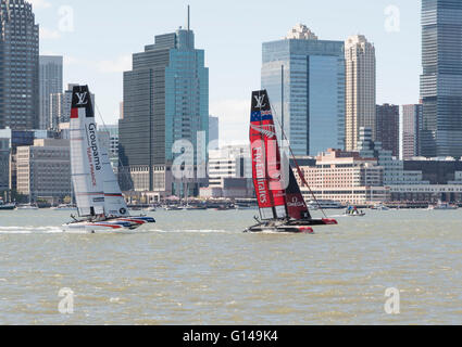 Emirates New Zealand team and Groupama France sailing yachts foiling in the 2016 America's Cup World Series in New York on the Hudson River. Stock Photo