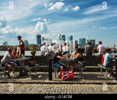 Greenwich, London, UK.  8th May 2016. Londoners enjoy the warm weather next to the River  Thames as temperatures rise Credit:  Eden Breitz/Alamy Live News Stock Photo