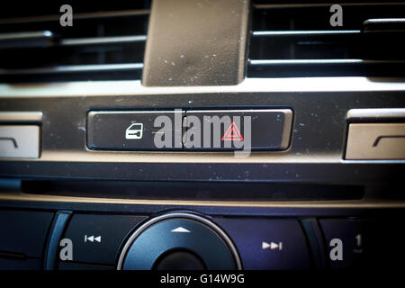 emergency button and Unlock the door button in car interior. Stock Photo