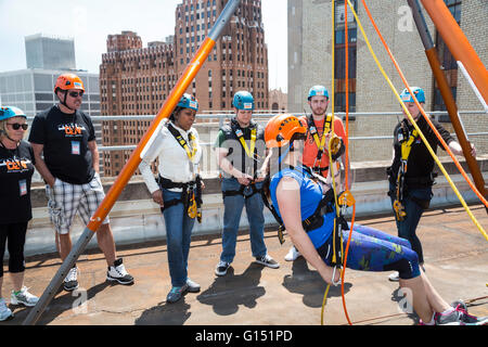 Detroit, Michigan - People get training in how to use the equipment before rappelling down the 25-story First National Building. Stock Photo