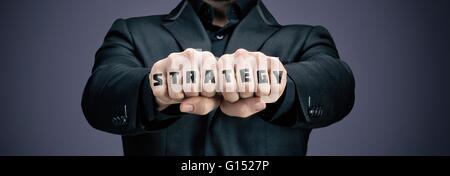 Businessman tattooed fists Stock Photo