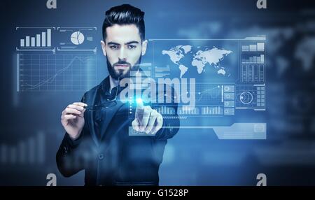 Portrait of a young Businessman touching a virtual screen Stock Photo